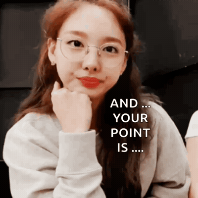 A Woman Wearing Glasses Has Her Hand On Her Chin And Says " And Your Point Is ... " GIF