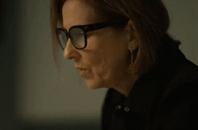 A Woman Wearing Glasses Is Drinking From A Can Of Soda GIF