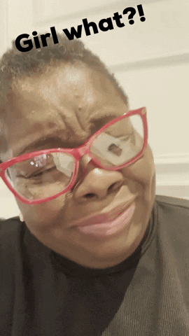 A Woman Wearing Glasses Is Making A Face With The Words Girl What Written Above Her GIF