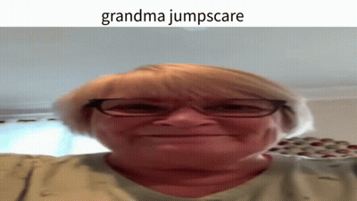 A Woman Wearing Glasses Is Making A Funny Face And The Caption Says Grandma Jumpscare GIF