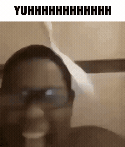 A Woman Wearing Glasses Is Making A Funny Face In A Black And White Photo . GIF
