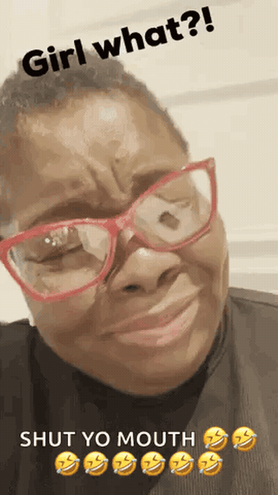 A Woman Wearing Glasses Is Making A Funny Face With The Words Girl What ? Shut Yo Mouth . GIF