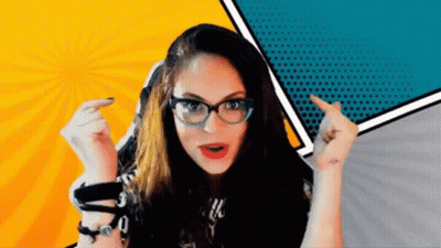 A Woman Wearing Glasses Is Pointing Her Finger At Something GIF