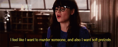 A Woman Wearing Glasses Is Saying That She Wants To Murder Someone And Also Wants Soft Pretzels . GIF