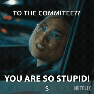 A Woman Wearing Glasses Is Sitting In A Car And Says `` To The Committee ? You Are So Stupid ! S '' GIF