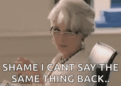 A Woman Wearing Glasses Is Sitting In A Chair And Saying `` Shame I Can 'T Say The Same Thing Back ... '' GIF