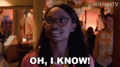 A Woman Wearing Glasses Is Smiling And Says Oh I Know GIF