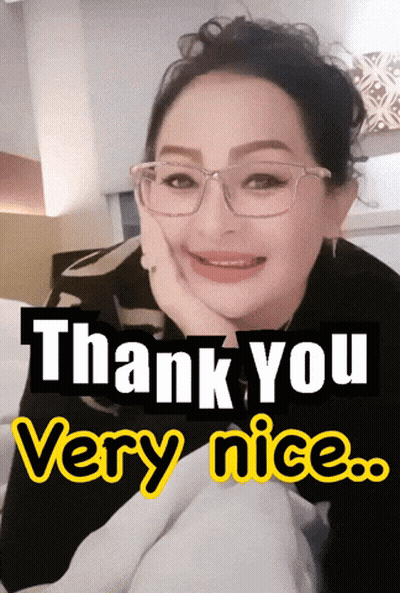 A Woman Wearing Glasses Is Smiling With The Words Thank You Very Nice Below Her GIF
