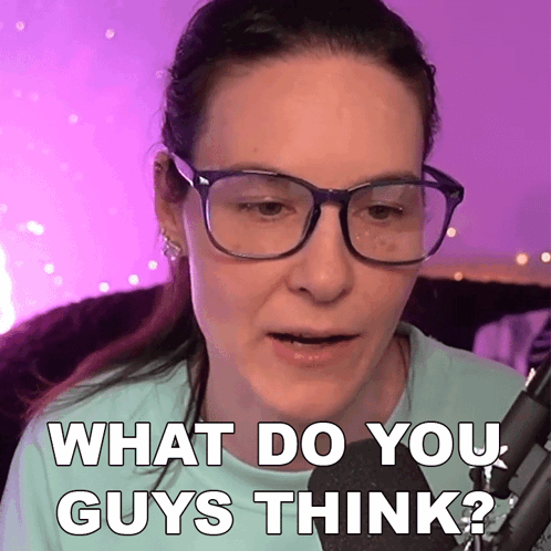 A Woman Wearing Glasses Is Talking Into A Microphone And Says " What Do You Guys Think " GIF