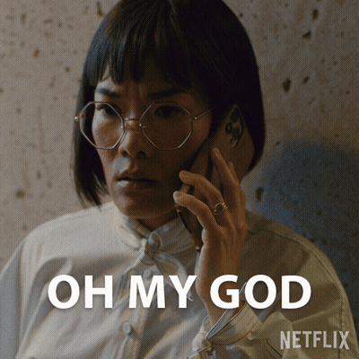 A Woman Wearing Glasses Is Talking On A Cell Phone With The Words Oh My God Written Below Her GIF