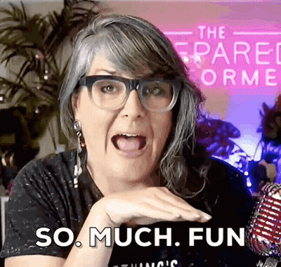 A Woman Wearing Glasses Says So Much Fun In Front Of A Sign That Says The Spare Norme GIF