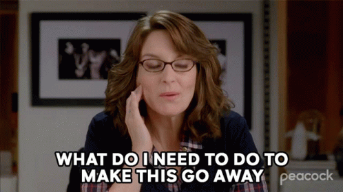 A Woman Wearing Glasses Says What Do I Need To Do To Make This Go Away GIF