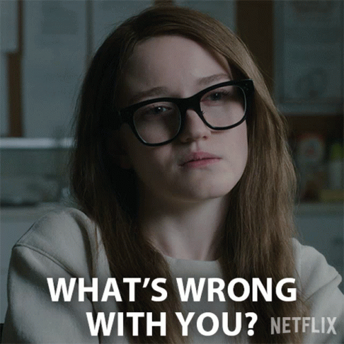 A Woman Wearing Glasses Says " What 'S Wrong With You " On A Netflix Ad GIF