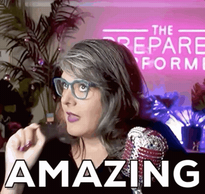 A Woman Wearing Glasses Stands In Front Of A Pink Sign That Says " The Prepare Form " GIF