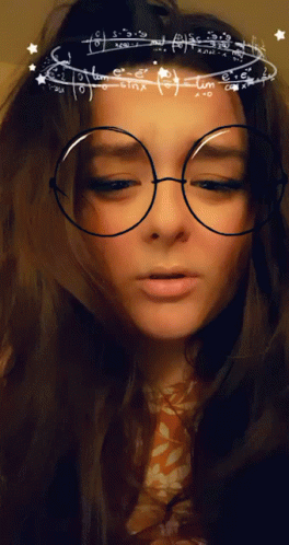 A Woman Wearing Glasses With Mathematical Equations On Them GIF