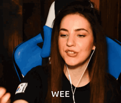 A Woman Wearing Headphones And A Black Shirt With The Word Wee On It GIF