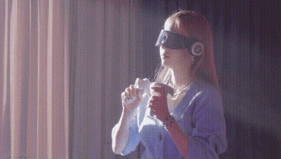 A Woman Wearing Headphones And A Blindfold Is Holding A Remote Control GIF