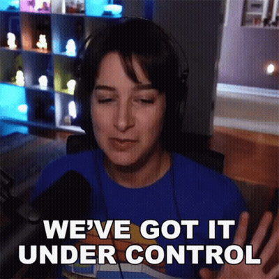 A Woman Wearing Headphones And A Blue Shirt Says " We 'Ve Got It Under Control " GIF