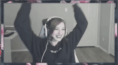 A Woman Wearing Headphones And A Microphone Is Sitting In Front Of A Computer Screen . GIF