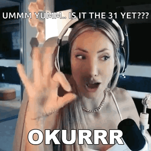 A Woman Wearing Headphones And A Microphone Says " Ummm Yumm ... Is It The 31 Yet " GIF