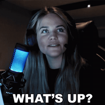 A Woman Wearing Headphones And A Microphone With The Words What 'S Up On The Bottom GIF