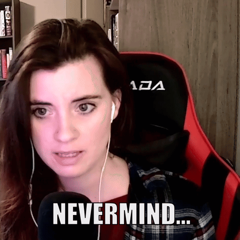 A Woman Wearing Headphones And A Red And Black Chair Says " Nevermind " GIF