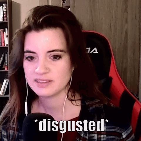 A Woman Wearing Headphones And A Red And Black Gaming Chair Says " Disgusted " GIF