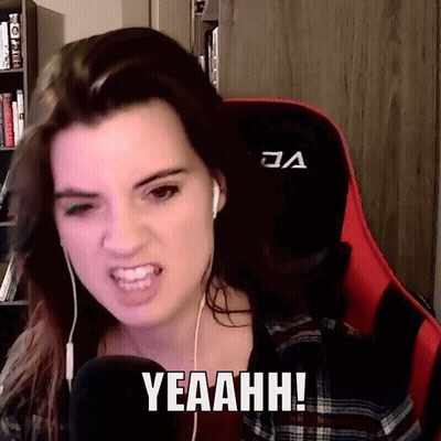A Woman Wearing Headphones And A Red Gaming Chair Says Yeaahhh GIF