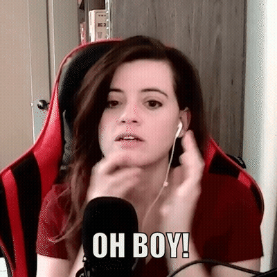 A Woman Wearing Headphones And A Red Shirt Is Sitting In Front Of A Microphone . GIF