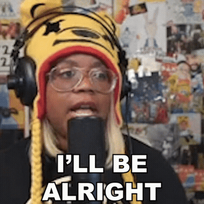 A Woman Wearing Headphones And A Tiger Hat Says I 'Ll Be Alright . GIF