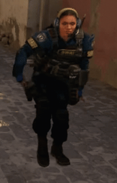 A Woman Wearing Headphones And A Vest That Says Memphis On It GIF