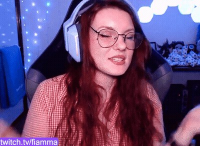 A Woman Wearing Headphones And Glasses Is On Twitch.tv/fiamma GIF