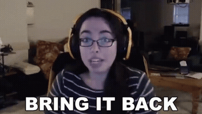 A Woman Wearing Headphones And Glasses Is Sitting In Front Of A Computer Screen . GIF