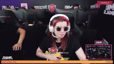 A Woman Wearing Headphones And Sunglasses Is Sitting In Front Of A Computer Screen That Says Game 4 Animals GIF