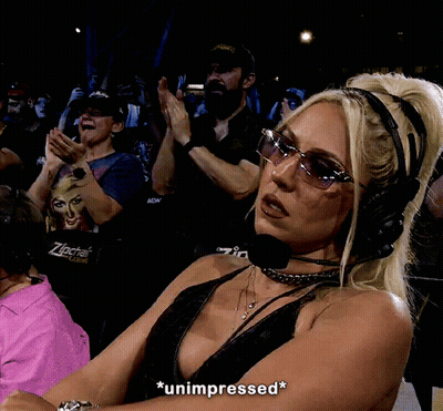 A Woman Wearing Headphones And Sunglasses Says Unimpressed GIF