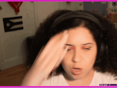A Woman Wearing Headphones Has A Sub Goal Of 2 On The Bottom Of The Screen GIF