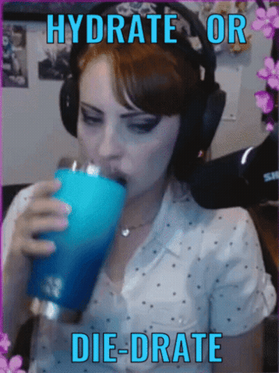 A Woman Wearing Headphones Is Drinking From A Blue Tumbler With The Words " Hydrate Or Die-Drate " On The Bottom GIF