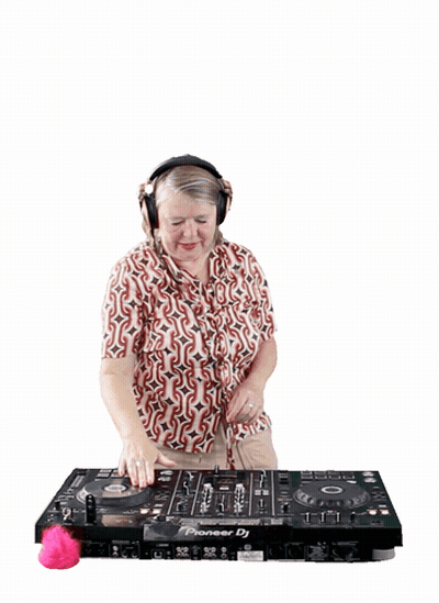A Woman Wearing Headphones Is Playing Music On A Pioneer Dj GIF