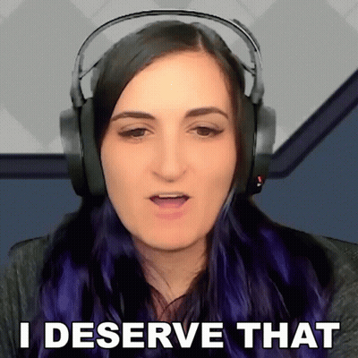 A Woman Wearing Headphones Is Saying " I Deserve That " GIF
