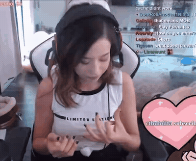 A Woman Wearing Headphones Is Sitting In A Chair With A Heart In Front Of Her GIF