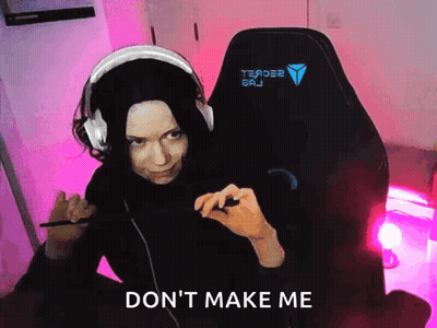 A Woman Wearing Headphones Is Sitting In A Chair With The Words " Do N't Make Me " Written On The Bottom GIF