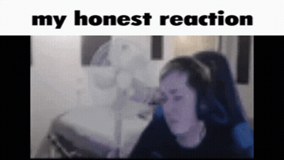 A Woman Wearing Headphones Is Sitting In Front Of A Fan With The Words " My Honest Reaction " Above Her GIF