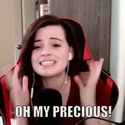 A Woman Wearing Headphones Is Sitting In Front Of A Microphone And Says Oh My Precious ! GIF