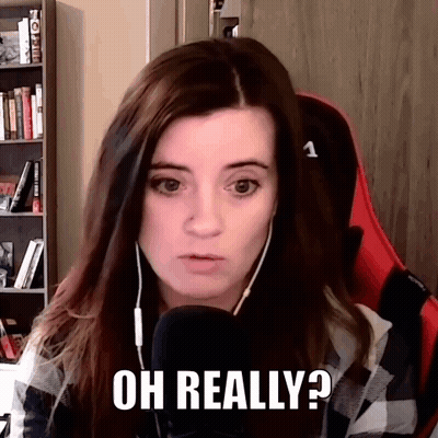 A Woman Wearing Headphones Is Sitting In Front Of A Microphone And Says Oh Really . GIF