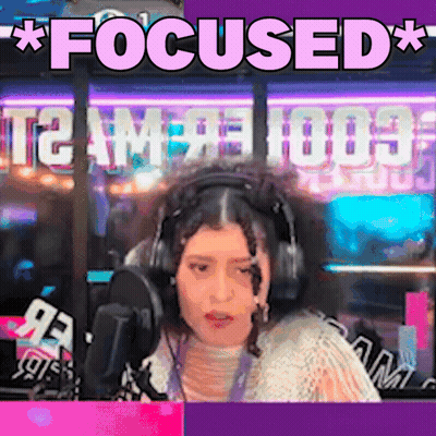 A Woman Wearing Headphones Is Sitting In Front Of A Microphone And The Words Focused Are Above Her GIF