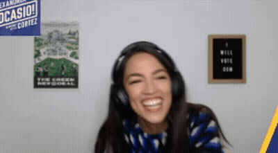 A Woman Wearing Headphones Is Smiling In Front Of A Poster That Says Casio GIF