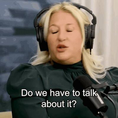 A Woman Wearing Headphones Is Talking Into A Microphone And Says Do We Have To Talk About It GIF