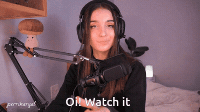 A Woman Wearing Headphones Says " Oil Watch It " GIF