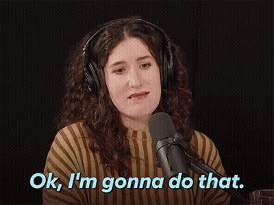 A Woman Wearing Headphones Says " Ok I 'M Gonna Do That " In Front Of A Microphone GIF