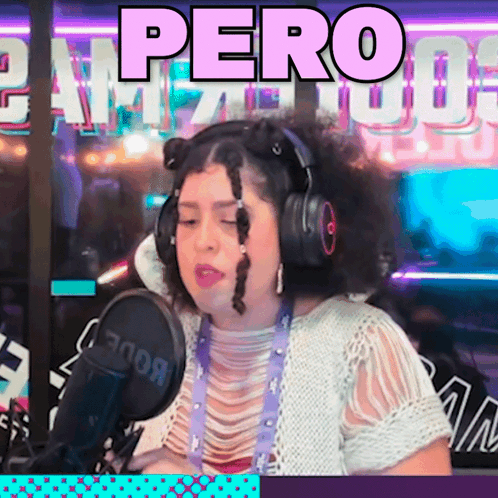 A Woman Wearing Headphones Stands In Front Of A Microphone With The Word Pero On The Bottom GIF